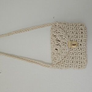 Lovely vintage beige macrame purse with golden brooch.